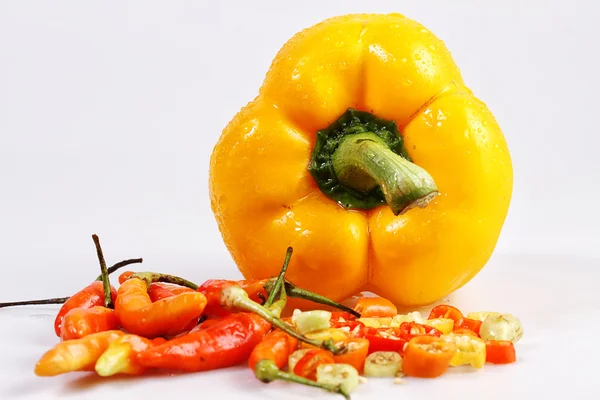 Small chilies and yellow paprika — Stock Photo, Image