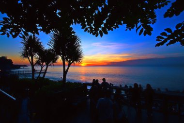 Silhouette and sunset at ayana resort bali clipart