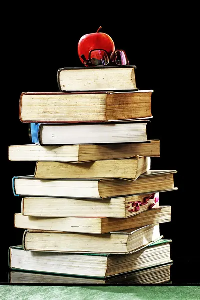 Stack of books, isolated on black and white — Stock Photo, Image