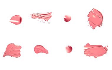 Mercan güzelliği kozmetik dokusu beyaz arka planda izole, lekeli makyaj emülsiyon kremi lekesi veya temel lekesi, ezilmiş kozmetik ürünler ve boya vuruşları