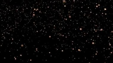 Siyah arka planda altın tatil parıltısı, akıntıya karşı altın parçacıkları akışı