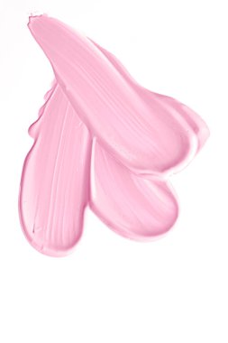 Beyaz arkaplanda yalıtılmış pembe güzellik kozmetik dokusu, lekeli makyaj kremi lekesi veya temel lekesi, kozmetik ürün ve boya vuruşları.