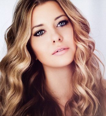 Beauty, makeup and glamour look. Beautiful blonde woman with curly hairstyle and smokey eyes evening make-up, closeup fashion portrait with retro film grain effect