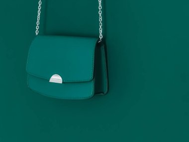 Özel tasarım çanta ve şık aksesuar, kadın modası ve lüks çanta koleksiyonu konseptiyle zümrüt yeşili deri çanta.