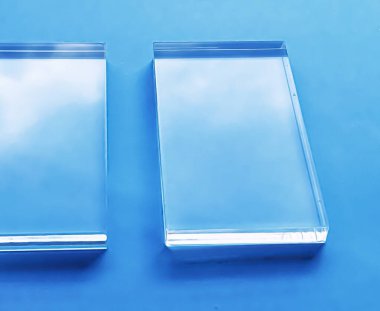 Glass device on blue background, future technology and abstract screen mockup design concept