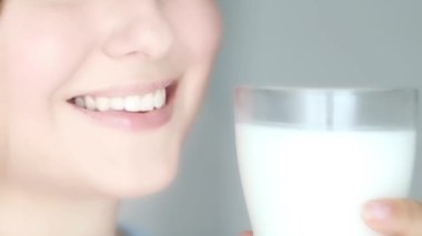 Healthy diet, teeth and dairy drink, perfect natural white toothy female smile and glass of milk closeup