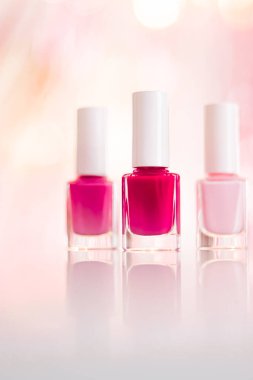 Shades of pink and red nail polish set on glamour background, nailpolish bottles for manicure and pedicure, luxury beauty cosmetics and make-up brand ad