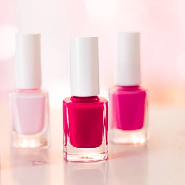 Shades of pink and red nail polish set on glamour background, nailpolish bottles for manicure and pedicure, luxury beauty cosmetics and make-up brand ad