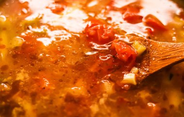 Cooking vegetable soup in saucepan, comfort food and homemade meal concept