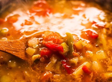Cooking vegetable soup in saucepan, comfort food and homemade meal concept