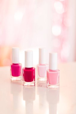 Shades of pink and red nail polish set on glamour background, nailpolish bottles for manicure and pedicure, luxury beauty cosmetics and make-up brand ad