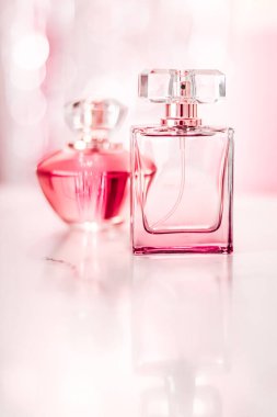 Perfume bottles on glamour background, floral feminine scent, fragrance and eau de parfum as luxury holiday gift, cosmetic and beauty brand present concept