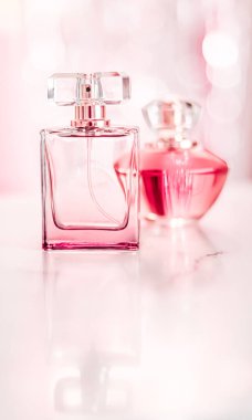 Perfume bottles on glamour background, floral feminine scent, fragrance and eau de parfum as luxury holiday gift, cosmetic and beauty brand present concept