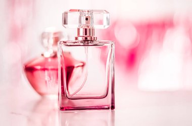 Perfume bottles on glamour background, floral feminine scent, fragrance and eau de parfum as luxury holiday gift, cosmetic and beauty brand present concept