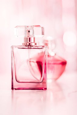 Perfume bottles on glamour background, floral feminine scent, fragrance and eau de parfum as luxury holiday gift, cosmetic and beauty brand present concept