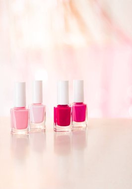 Shades of pink and red nail polish set on glamour background, nailpolish bottles for manicure and pedicure, luxury beauty cosmetics and make-up brand ad