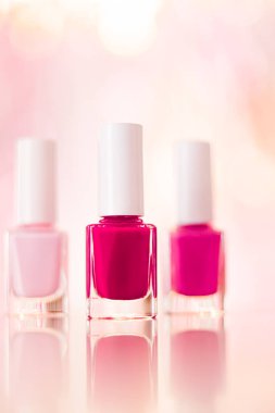 Shades of pink and red nail polish set on glamour background, nailpolish bottles for manicure and pedicure, luxury beauty cosmetics and make-up brand ad