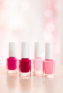 Shades of pink and red nail polish set on glamour background, nailpolish bottles for manicure and pedicure, luxury beauty cosmetics and make-up brand ad
