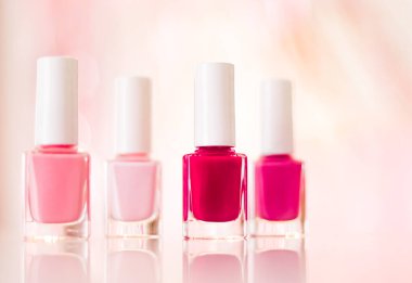 Shades of pink and red nail polish set on glamour background, nailpolish bottles for manicure and pedicure, luxury beauty cosmetics and make-up brand ad