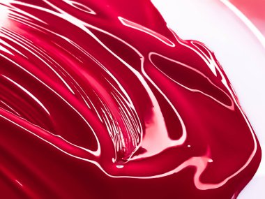 Glossy red cosmetic texture as beauty make-up product background, skincare cosmetics and luxury makeup brand design concept
