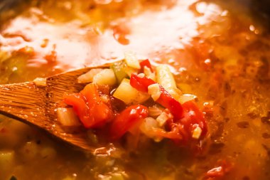 Cooking vegetable soup in saucepan, comfort food and homemade meal concept