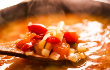 Cooking vegetable soup in saucepan, comfort food and homemade meal concept