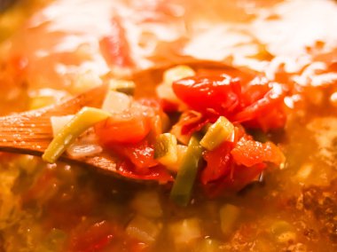 Cooking vegetable soup in saucepan, comfort food and homemade meal concept