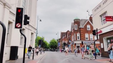 St Albans, Hertfordshire, England in June 2022: Driving in beautiful English town centre street, historic buildings, shops and market. High quality 4k footage