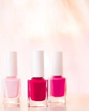 Shades of pink and red nail polish set on glamour background, nailpolish bottles for manicure and pedicure, luxury beauty cosmetics and make-up brand ad