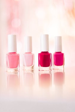 Shades of pink and red nail polish set on glamour background, nailpolish bottles for manicure and pedicure, luxury beauty cosmetics and make-up brand ad