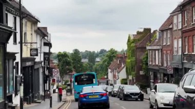 St Albans, Hertfordshire, England in June 2022: Driving in beautiful English town centre street, historic buildings, shops and market. High quality 4k footage