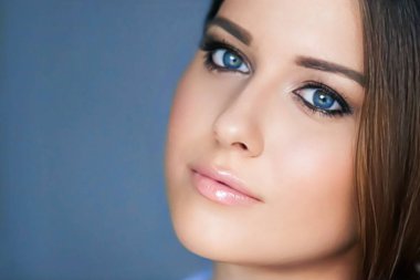 Beauty and make-up, beautiful woman with smokey eyes makeup, face portrait close-up