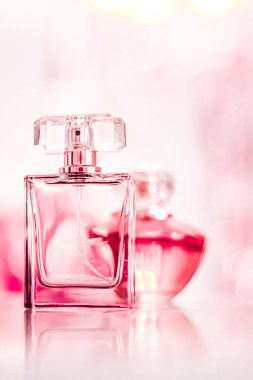 Perfume bottles on glamour background, floral feminine scent, fragrance and eau de parfum as luxury holiday gift, cosmetic and beauty brand present concept