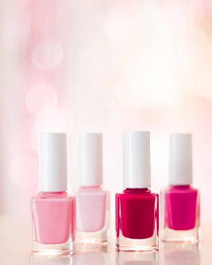 Shades of pink and red nail polish set on glamour background, nailpolish bottles for manicure and pedicure, luxury beauty cosmetics and make-up brand ad