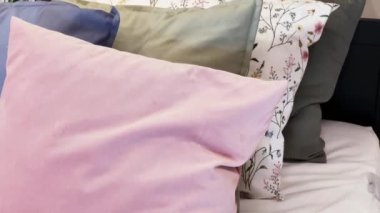 Vintage countryside style bedding with floral pattern on wooden bed in bedroom, interior design detail