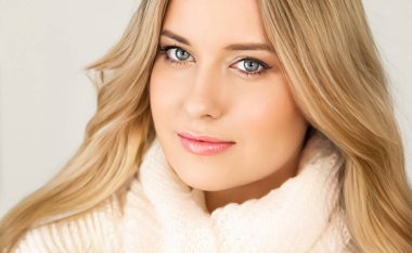 Autumn winter fashion and knitwear, beautiful woman wearing warm knitted scarf, close-up portrait clipart