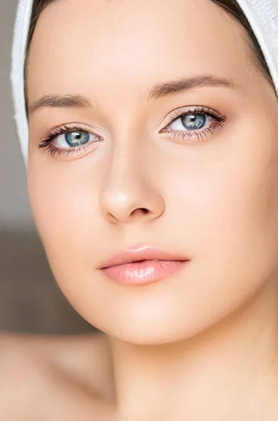 Skin care and beauty routine, beautiful woman with white towel wrapped around head, skincare cosmetics and face cosmetology, close-up portrait