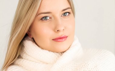Autumn winter fashion and knitwear, beautiful woman wearing warm knitted scarf, close-up portrait
