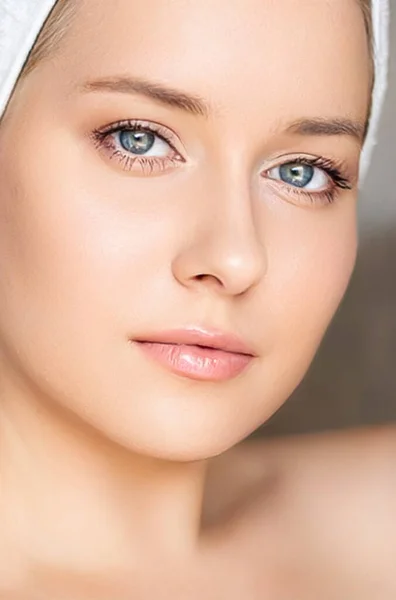 Skin care and beauty routine, beautiful woman with white towel wrapped around head, skincare cosmetics and face cosmetology, close-up portrait