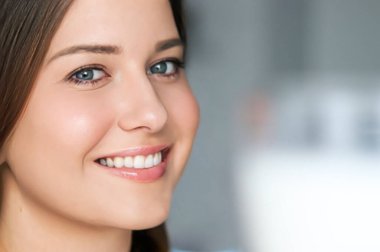 Diet and wellness, young woman with glass of milk or protein shake cocktail, portrait
