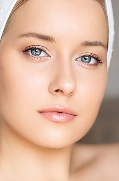 Skin care and beauty routine, beautiful woman with white towel wrapped around head, skincare cosmetics and face cosmetology, close-up portrait