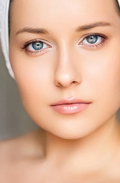 Skin care and beauty routine, beautiful woman with white towel wrapped around head, skincare cosmetics and face cosmetology, close-up portrait