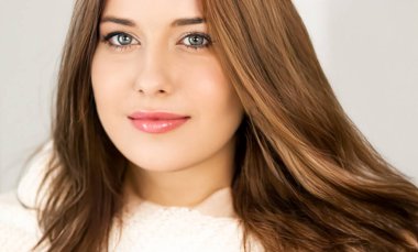 Autumn winter fashion and knitwear, beautiful woman wearing warm knitted scarf, close-up portrait