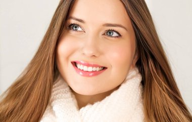 Autumn winter fashion and knitwear, beautiful woman wearing warm knitted scarf, close-up portrait