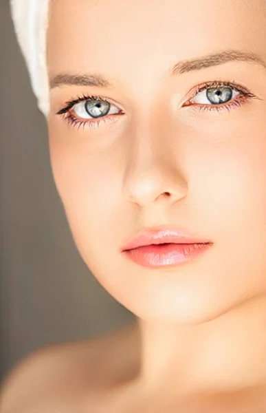 Skin care and beauty routine, beautiful woman with white towel wrapped around head, skincare cosmetics and face cosmetology, close-up portrait