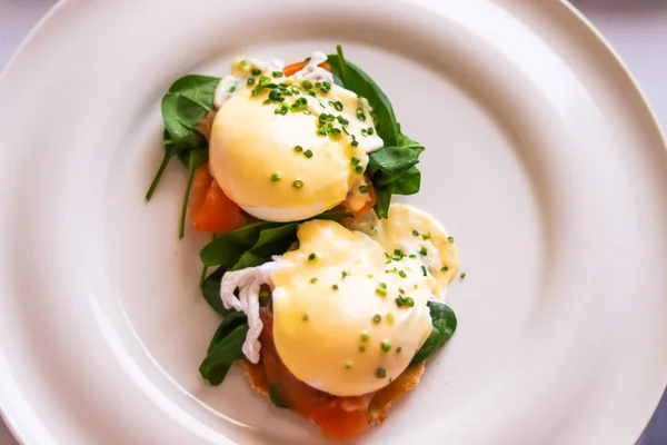 Luxury breakfast, brunch and food recipe, poached eggs with salmon and greens on gluten-free toast for restaurant menu and gastronomy branding