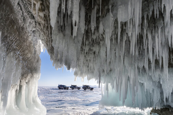 SUV trucks on winter Baikal lake