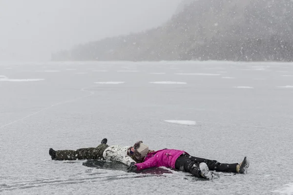 Female tourists having fun on frozen lake of Baikal, Russia — Stock Photo, Image