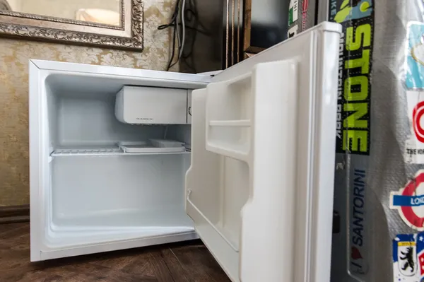 Mini fridge in hotel room — Stock Photo, Image