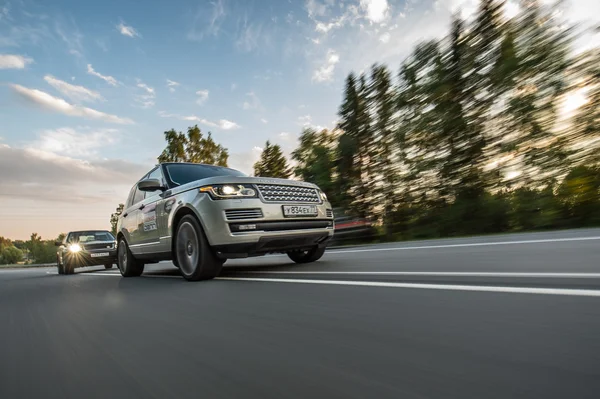 Suv cars on a road — Stock Photo, Image